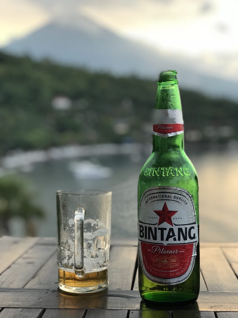 Drinking Bintang beer at sunset View Jemeluk Bay Amed East-Bali